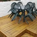 Outside decking with a table and chairs